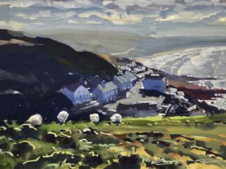 sheep grazing on Morte point Devon with Woolacombe beach in the distance